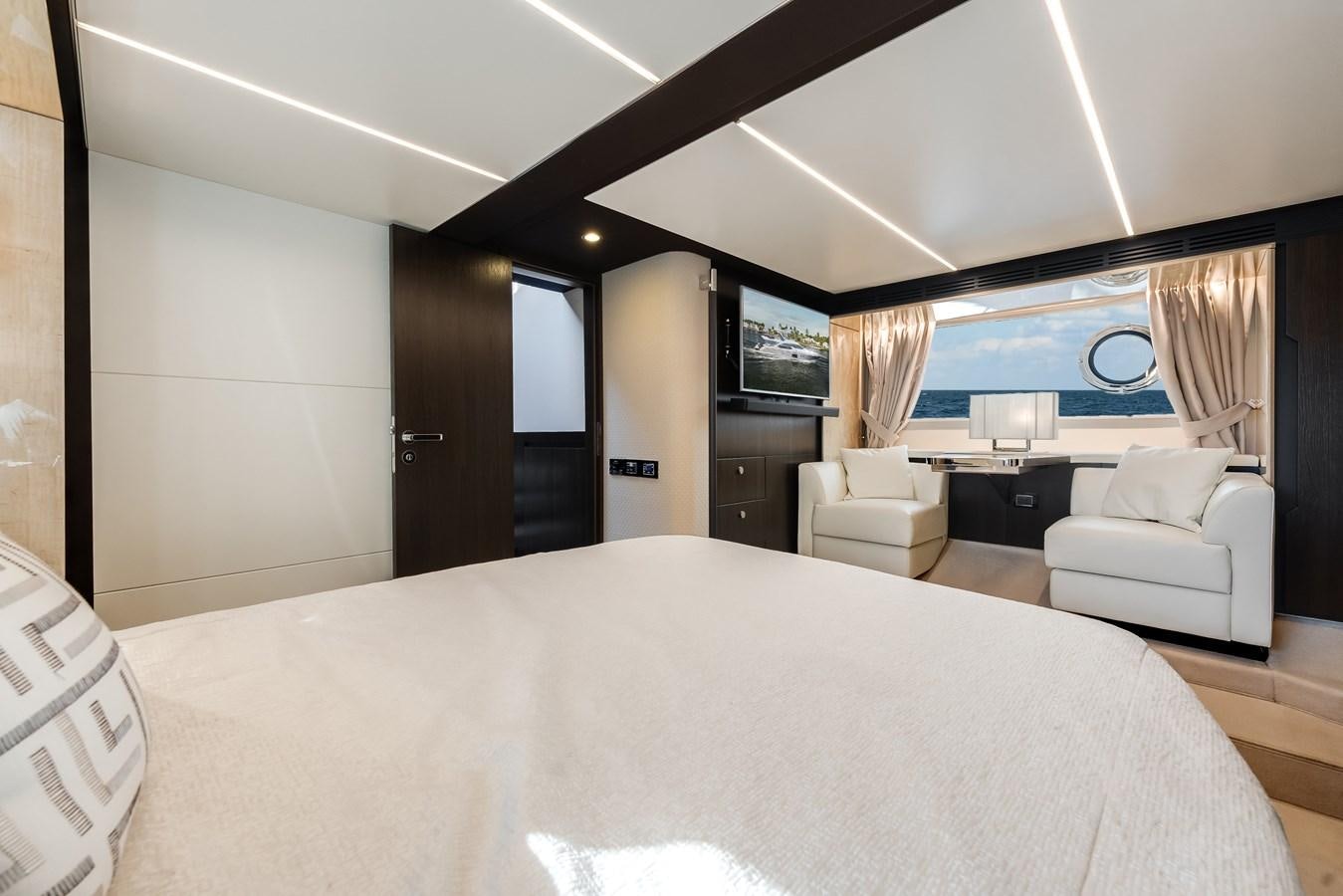 a large hotel room with a large bed and a tv aboard TRUTH SERUM Yacht for Sale