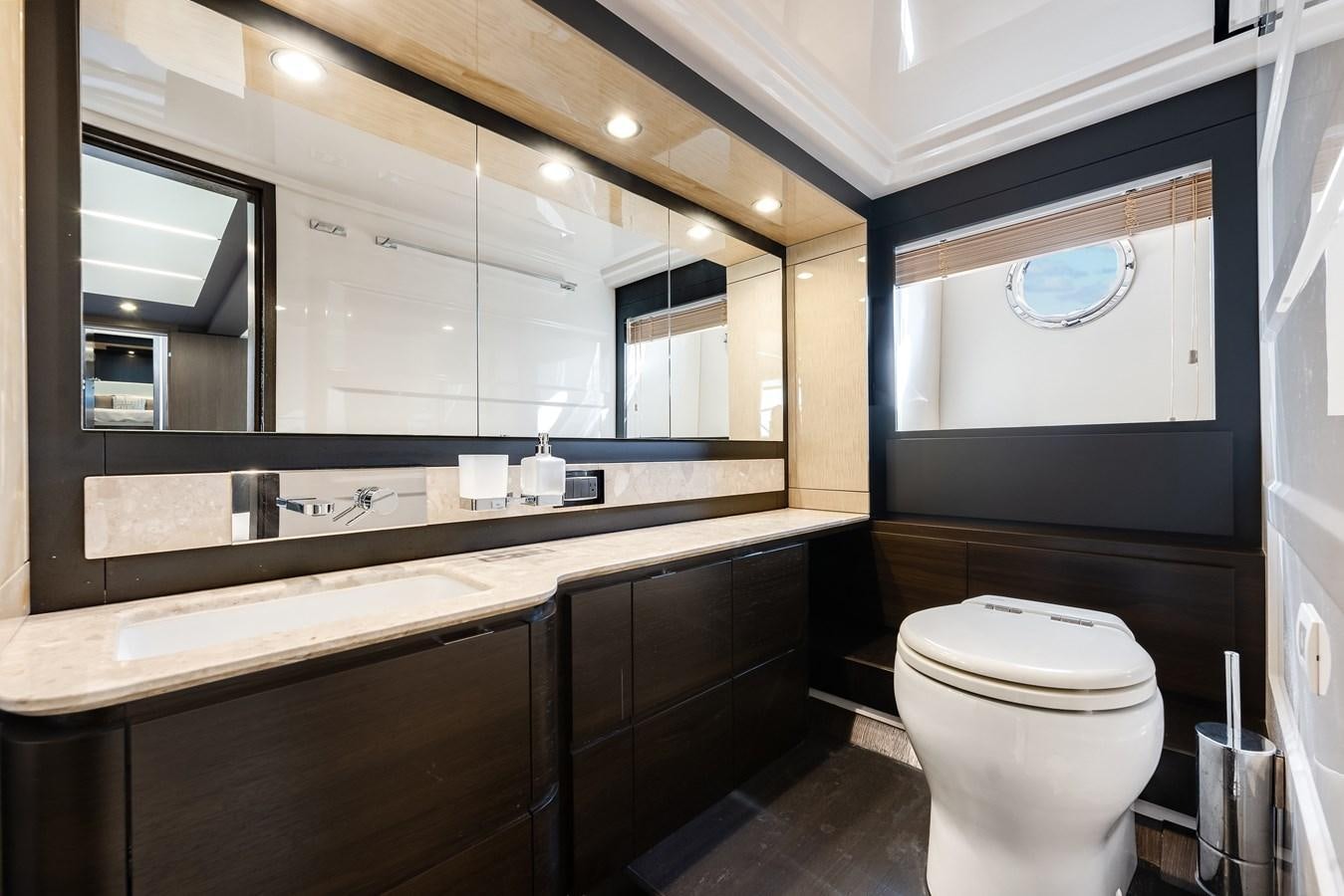 a bathroom with a large mirror aboard TRUTH SERUM Yacht for Sale