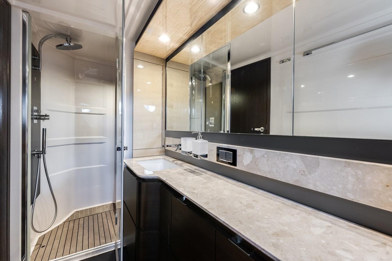 a bathroom with a glass shower aboard TRUTH SERUM Yacht for Sale