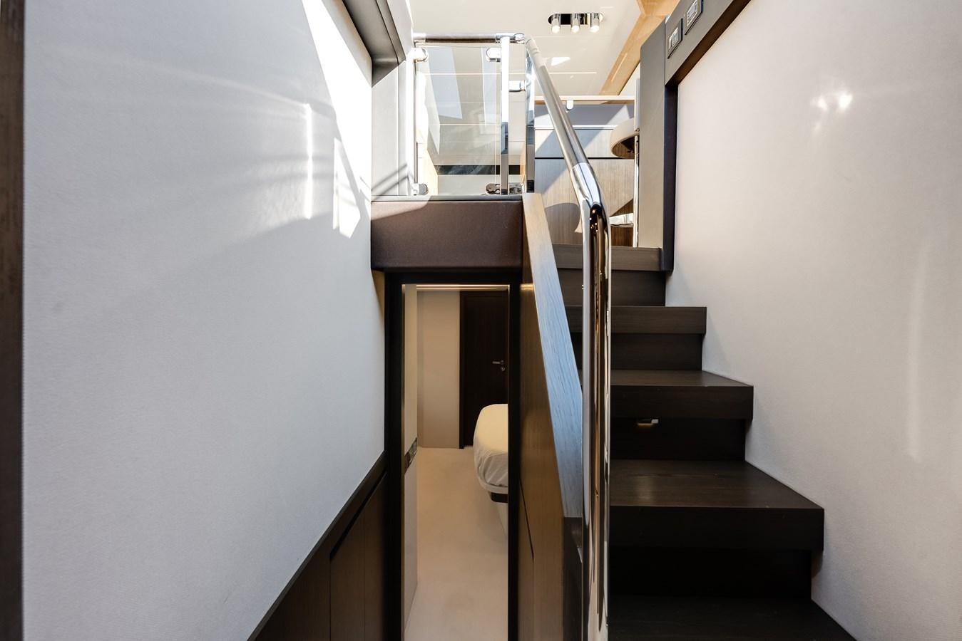 a staircase with a set of stairs aboard TRUTH SERUM Yacht for Sale