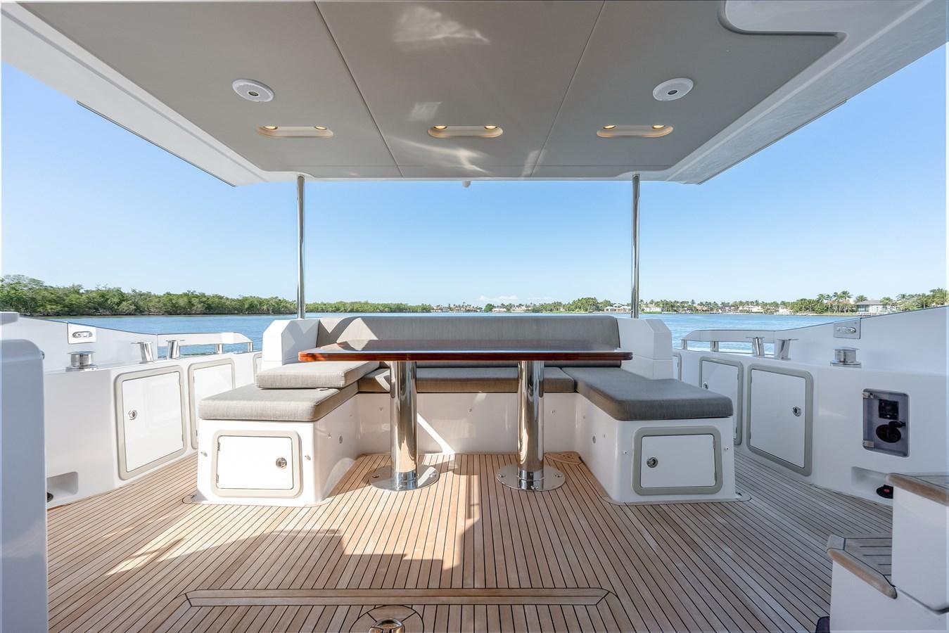 a large room with a pool table and chairs aboard TRUTH SERUM Yacht for Sale