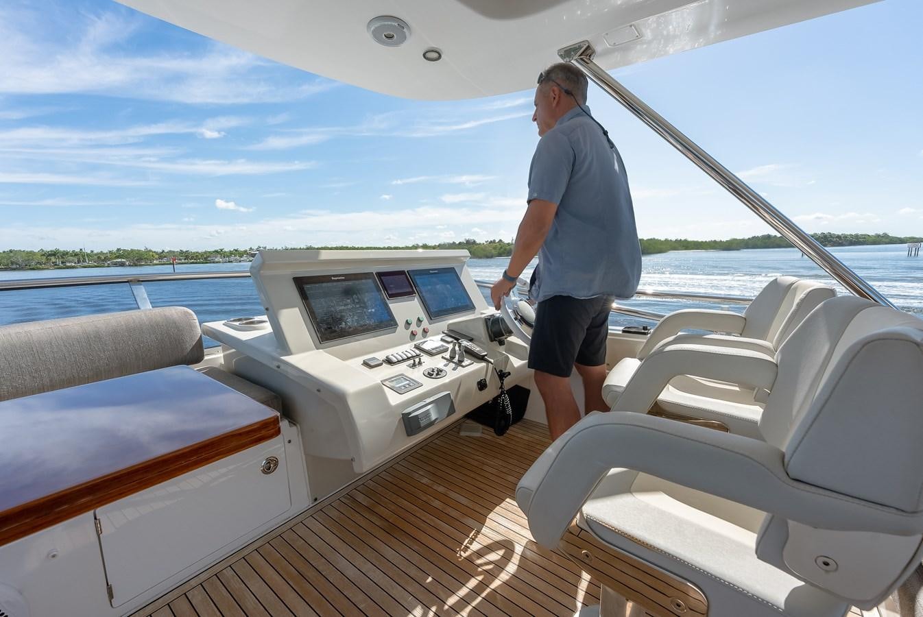 a man standing on a boat aboard TRUTH SERUM Yacht for Sale