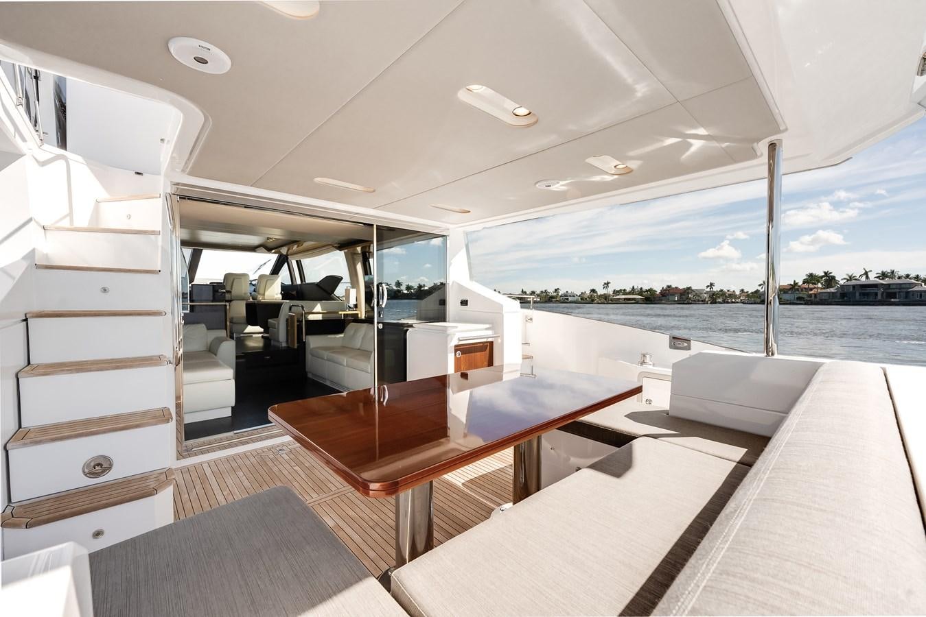 a room with a table and chairs aboard TRUTH SERUM Yacht for Sale