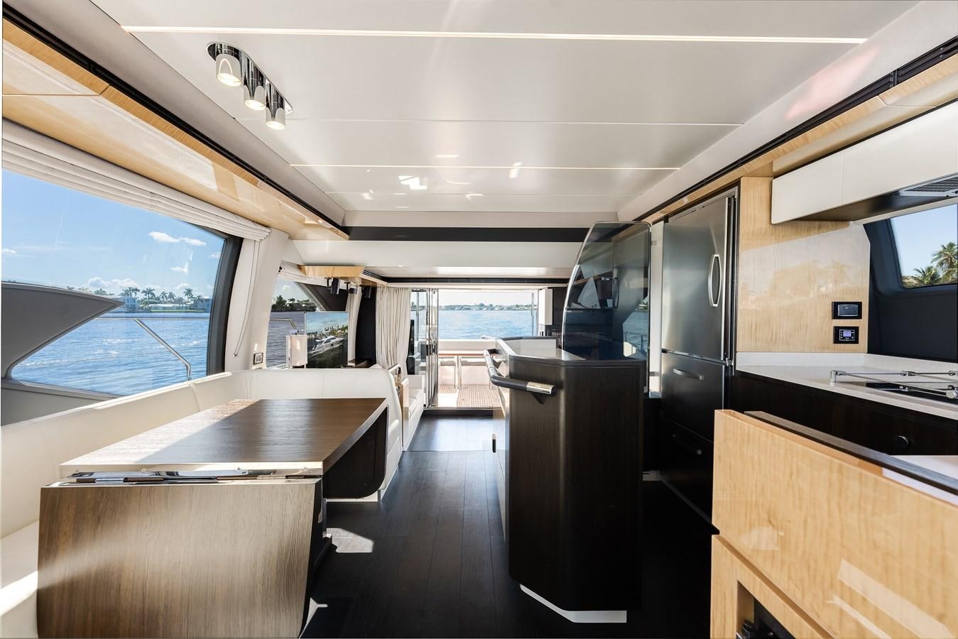 a room with a table and chairs aboard TRUTH SERUM Yacht for Sale