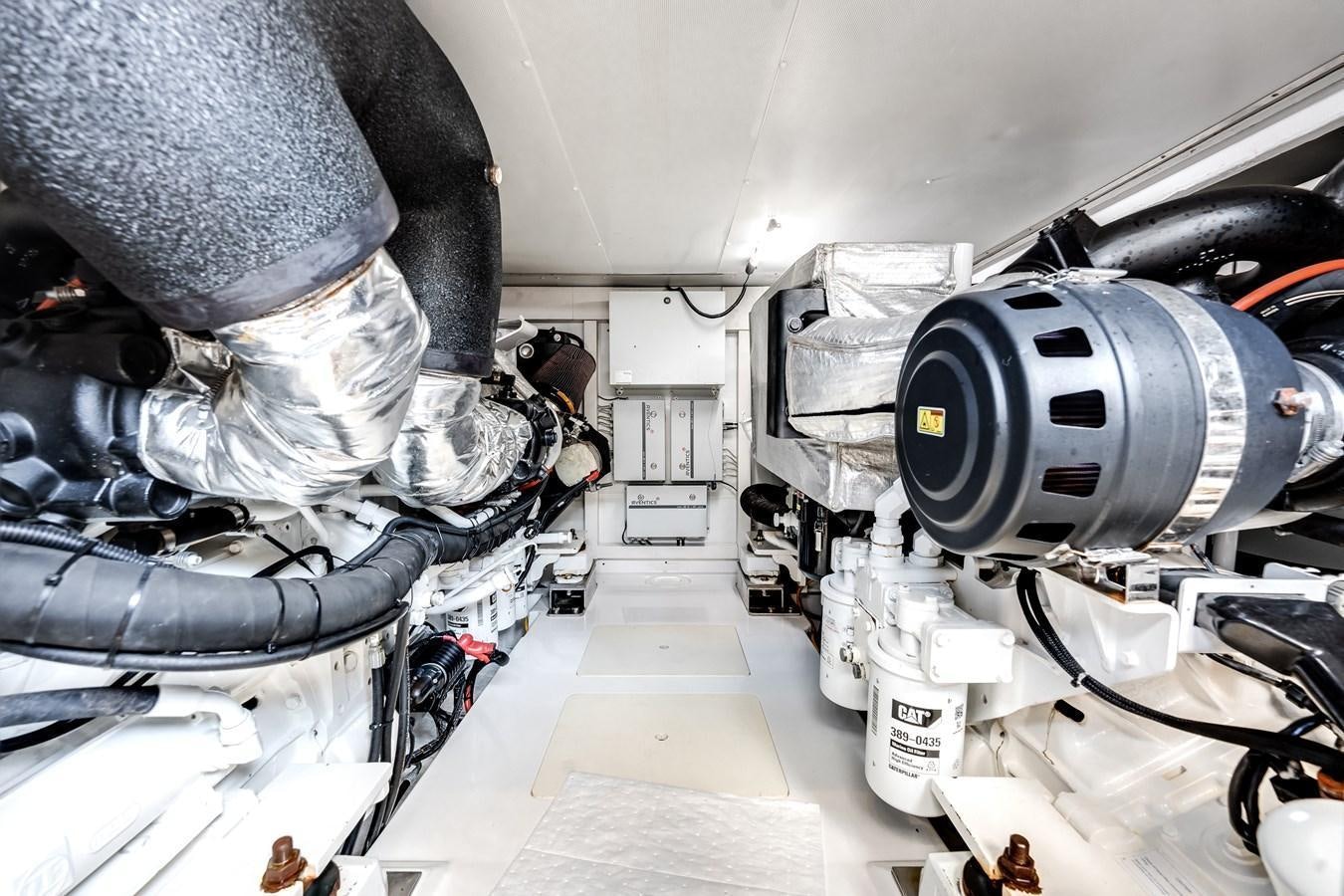 a person working on a car aboard TRUTH SERUM Yacht for Sale