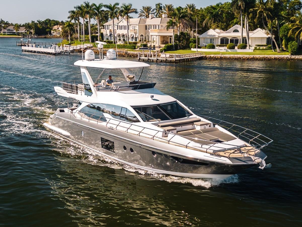 a white boat on water aboard TRUTH SERUM Yacht for Sale
