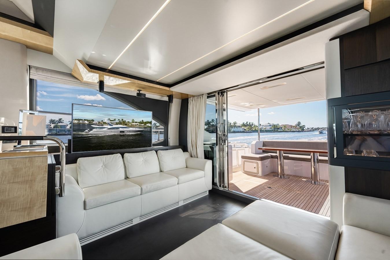 a living room with a large window aboard TRUTH SERUM Yacht for Sale