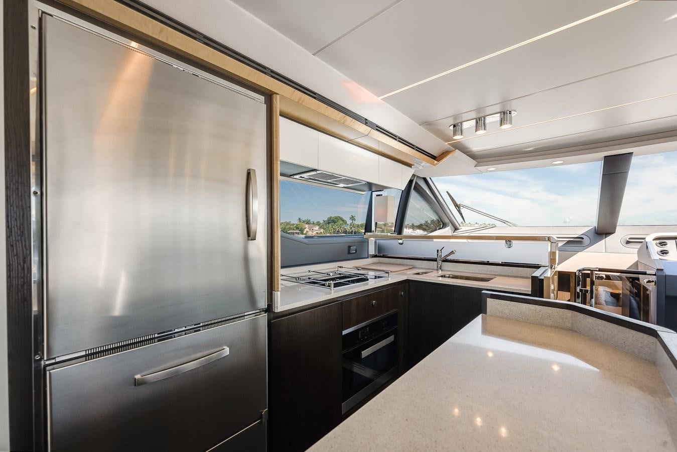 a kitchen with a large refrigerator aboard TRUTH SERUM Yacht for Sale