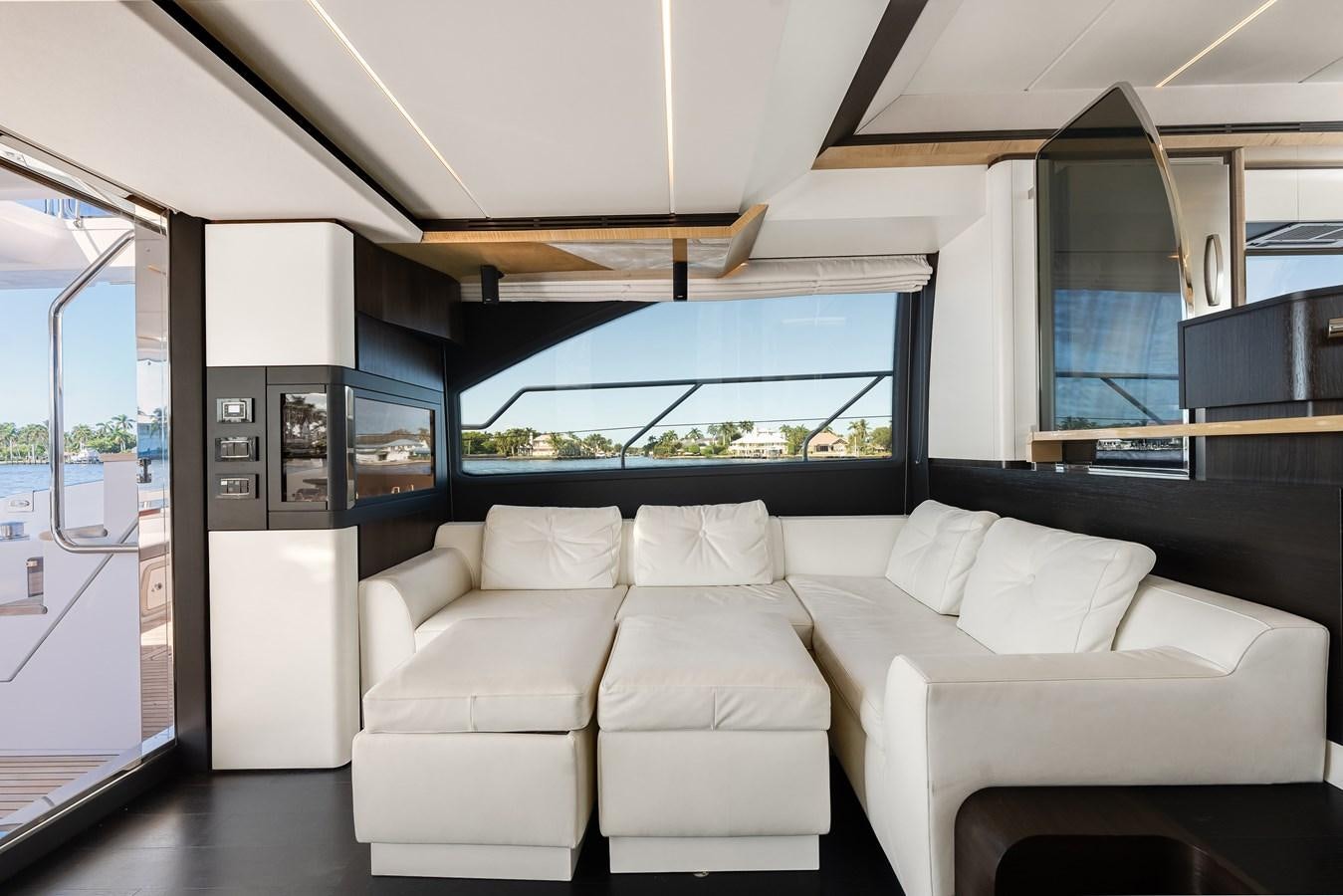 a white couch in a room aboard TRUTH SERUM Yacht for Sale