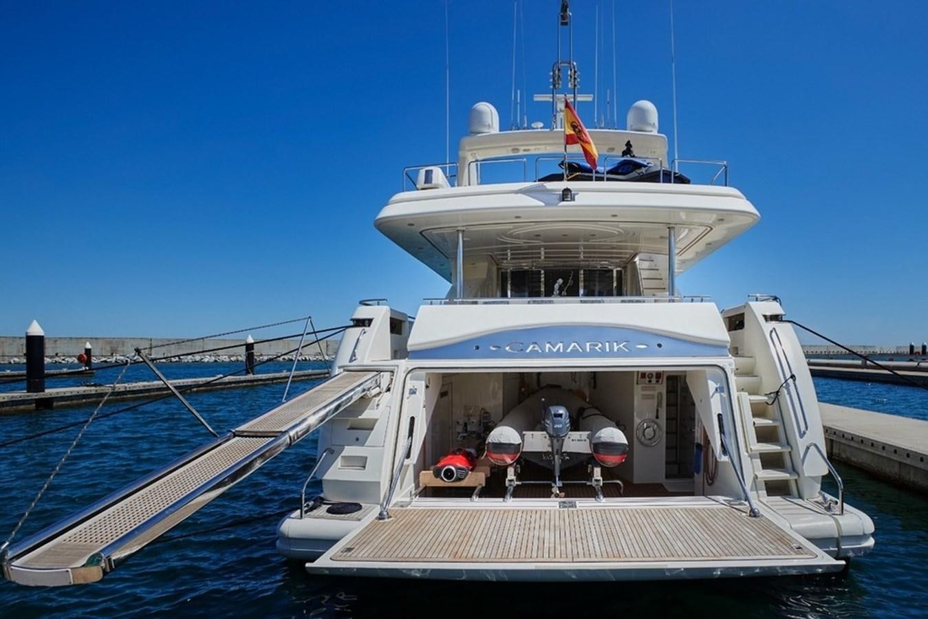 a boat docked at a pier aboard CAMARIK Yacht for Sale