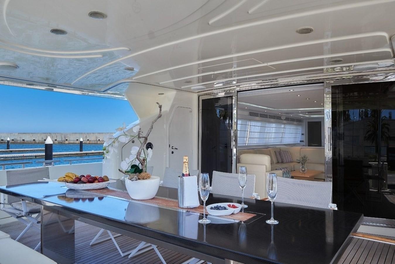 a large kitchen with a table and chairs aboard CAMARIK Yacht for Sale