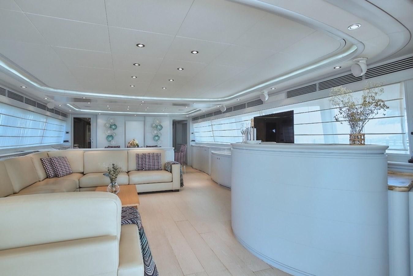 a large living room with a large window aboard CAMARIK Yacht for Sale