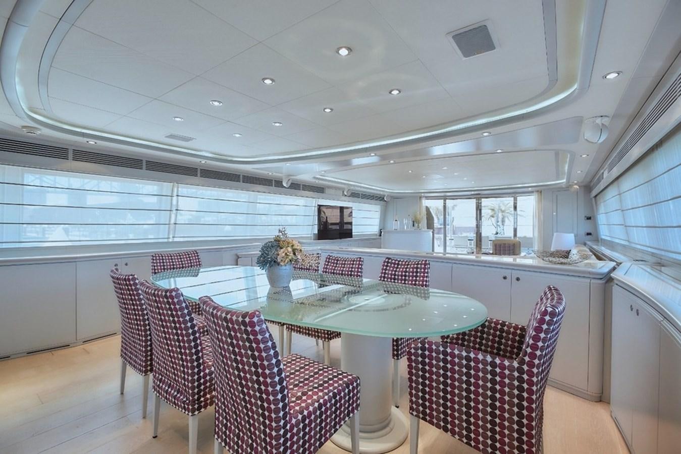 a large kitchen with a table and chairs aboard CAMARIK Yacht for Sale