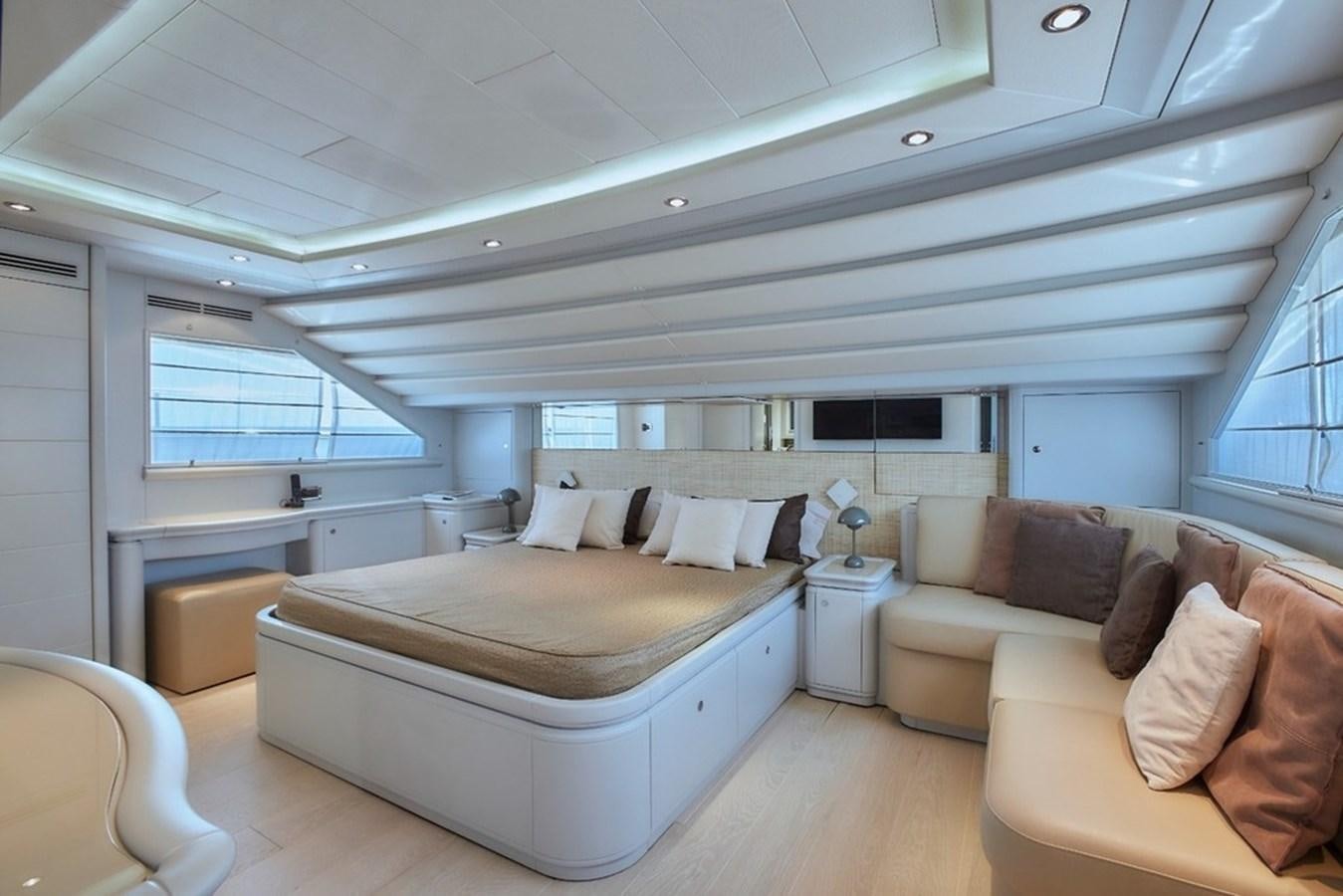 a large bedroom with a bed aboard CAMARIK Yacht for Sale