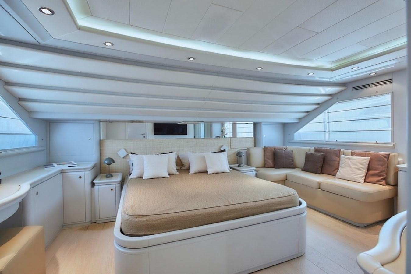 a room with a bed and a couch aboard CAMARIK Yacht for Sale