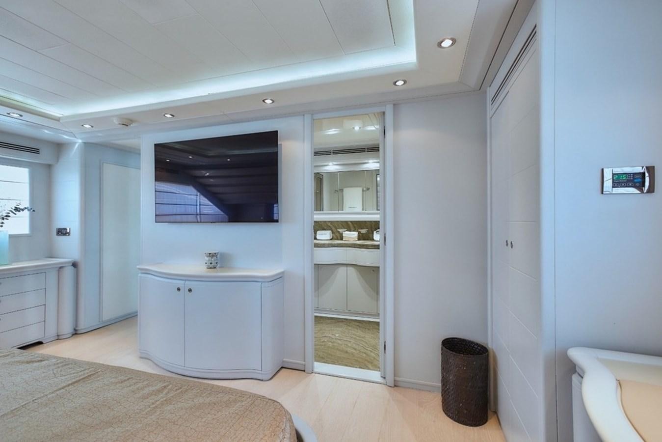 a bathroom with a tub sink and cabinets aboard CAMARIK Yacht for Sale