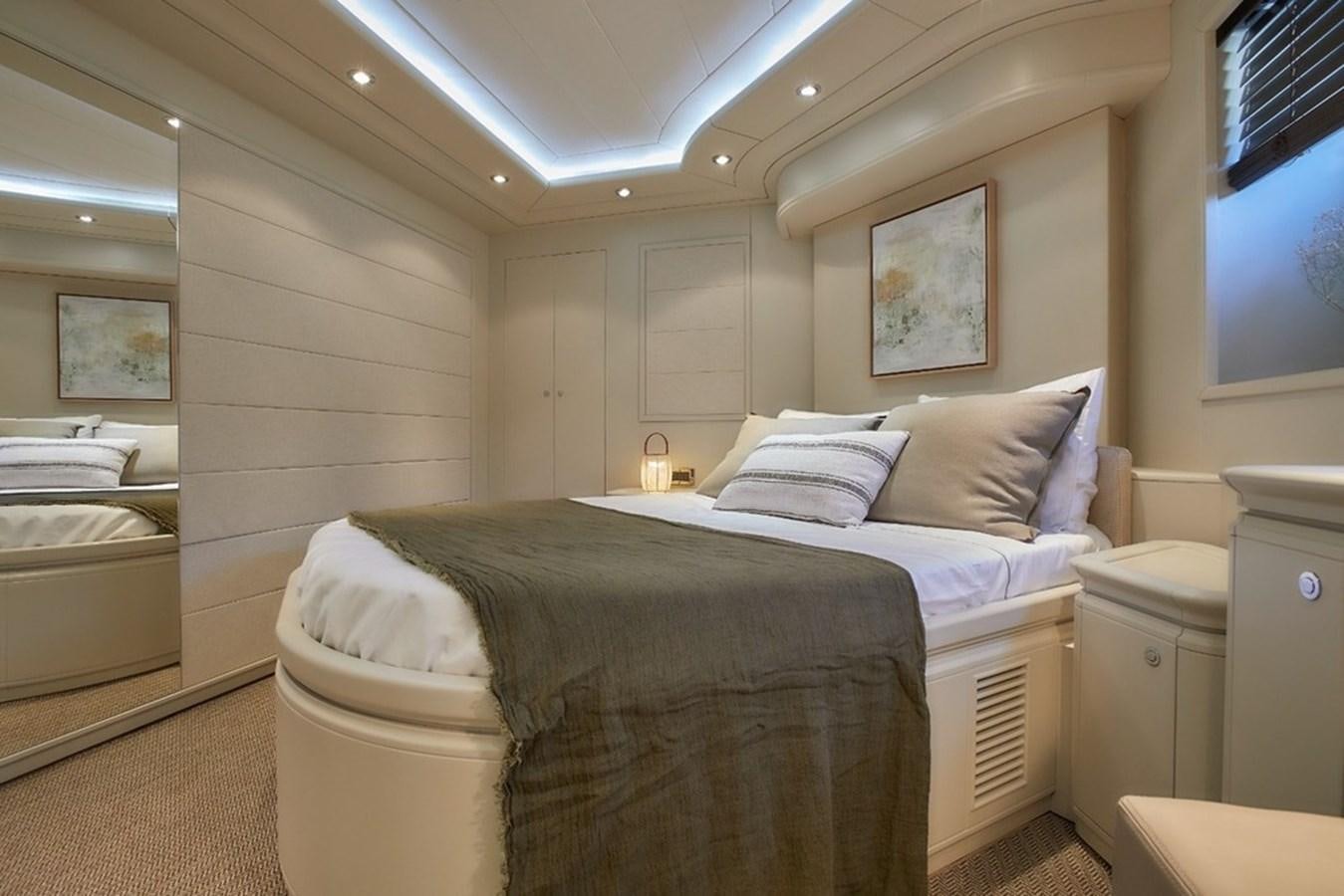 a room with a bed and a television aboard CAMARIK Yacht for Sale