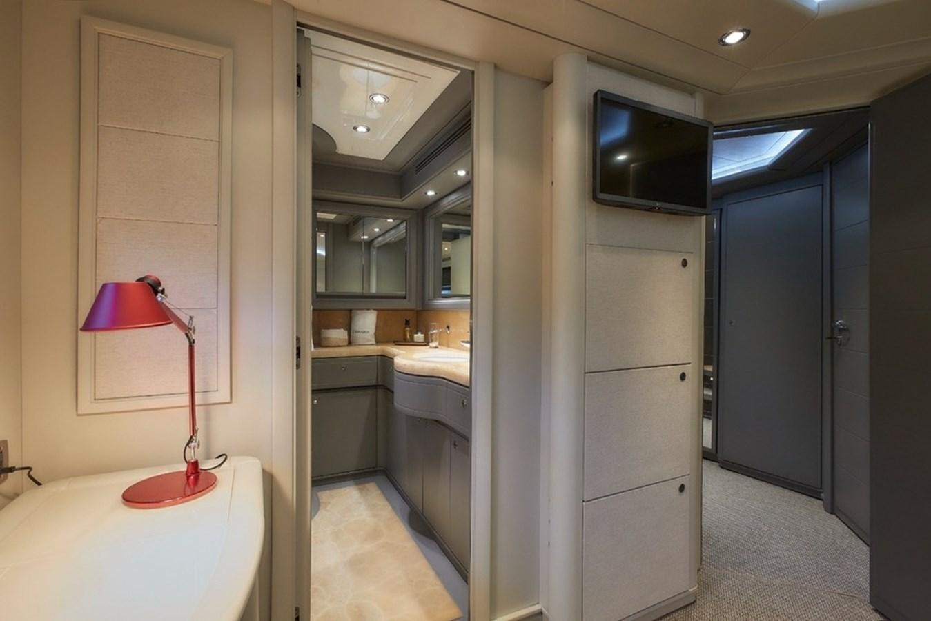 a bathroom with a lamp and a mirror aboard CAMARIK Yacht for Sale