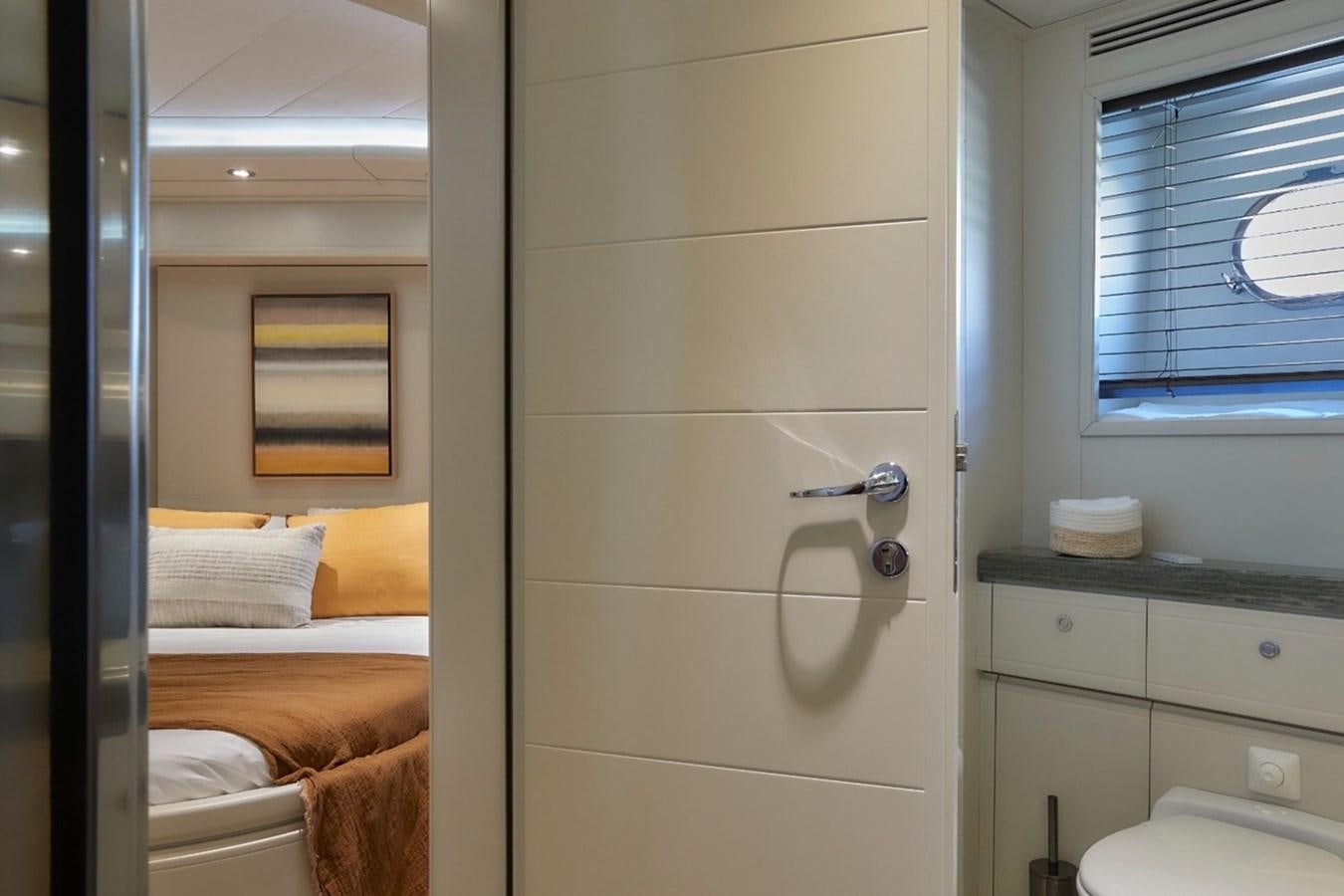 a door open to a bed aboard CAMARIK Yacht for Sale