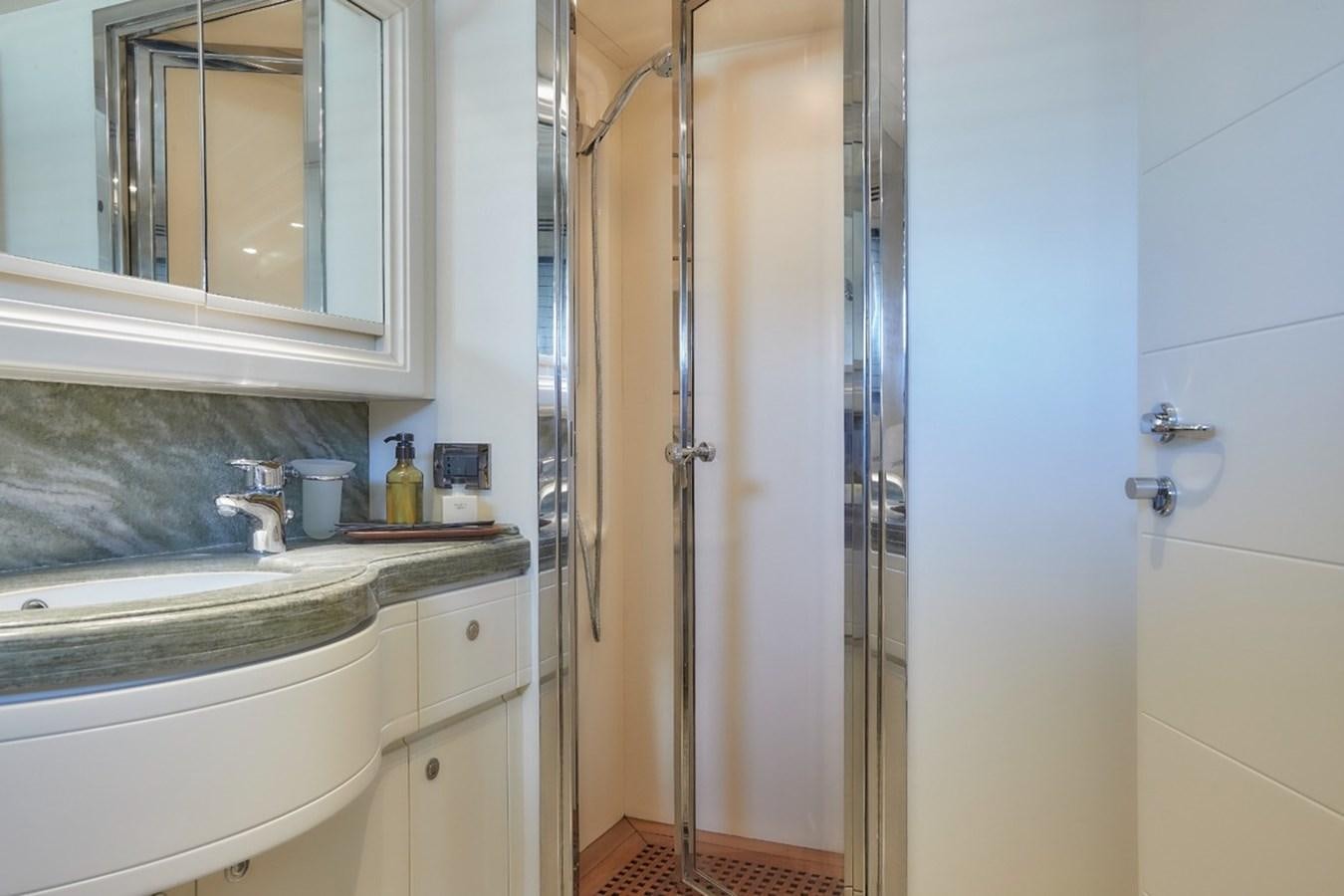 a bathroom with a glass shower aboard CAMARIK Yacht for Sale