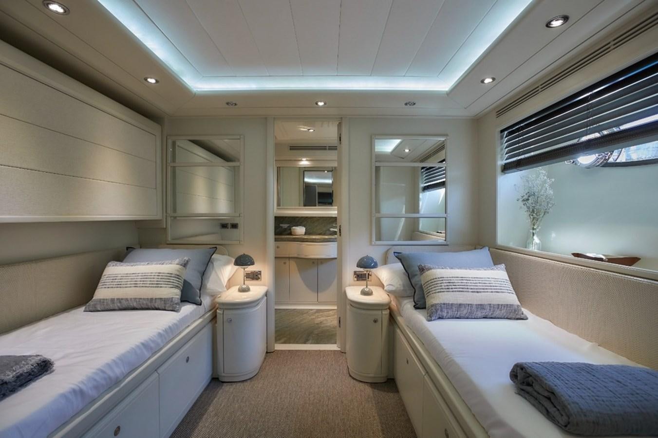 a room with two beds aboard CAMARIK Yacht for Sale