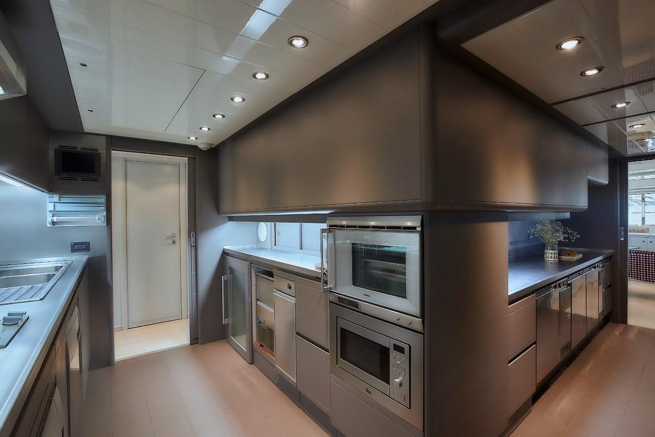 a kitchen with stainless steel appliances aboard CAMARIK Yacht for Sale