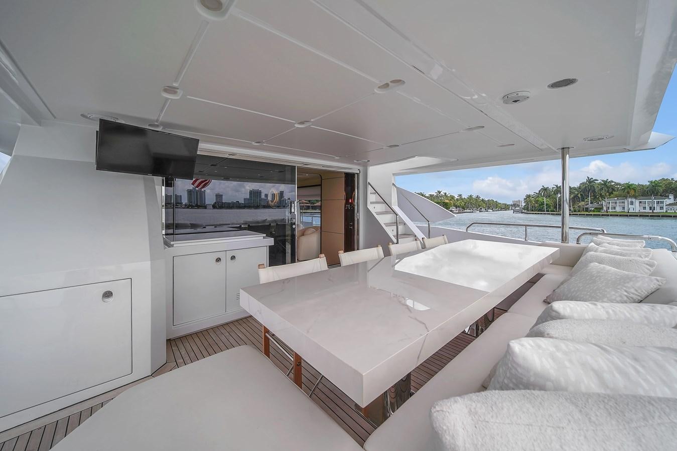 a room with a couch and a table aboard 95 RAISED PILOTHOUSE Yacht for Sale
