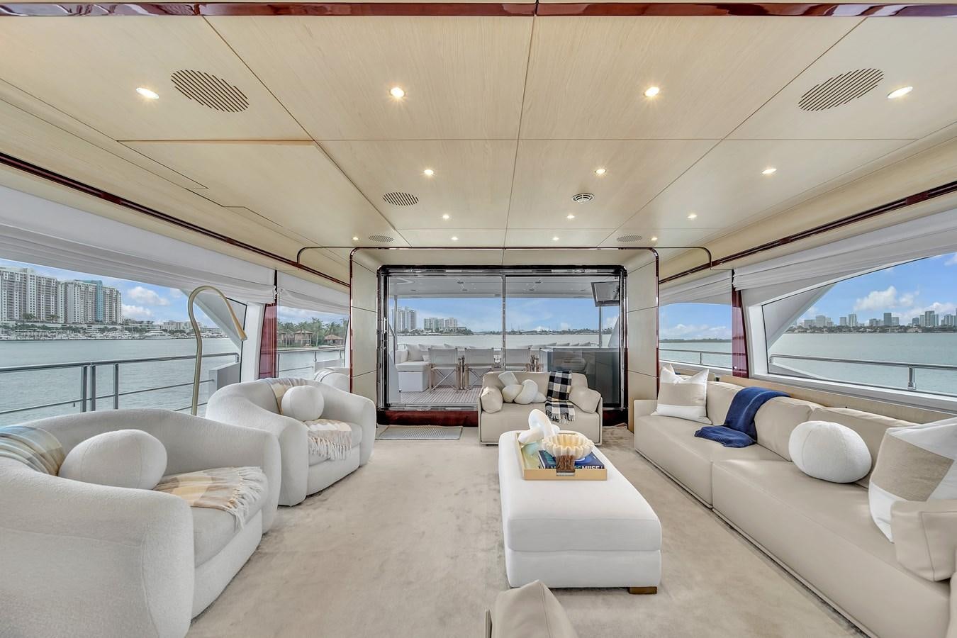 a living room with a large window aboard 95 RAISED PILOTHOUSE Yacht for Sale