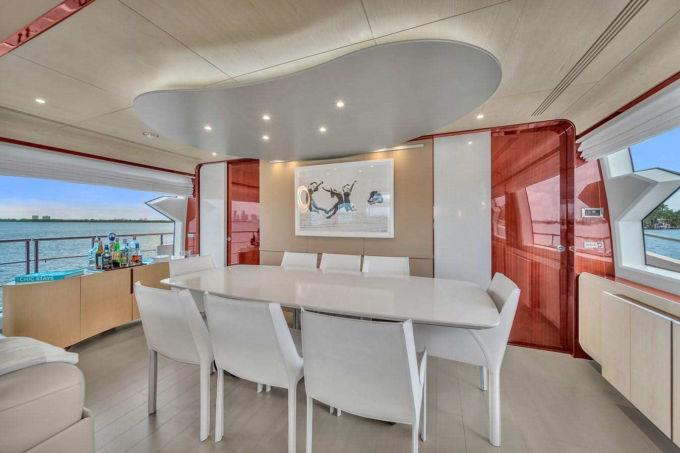 a room with tables and chairs aboard 95 RAISED PILOTHOUSE Yacht for Sale