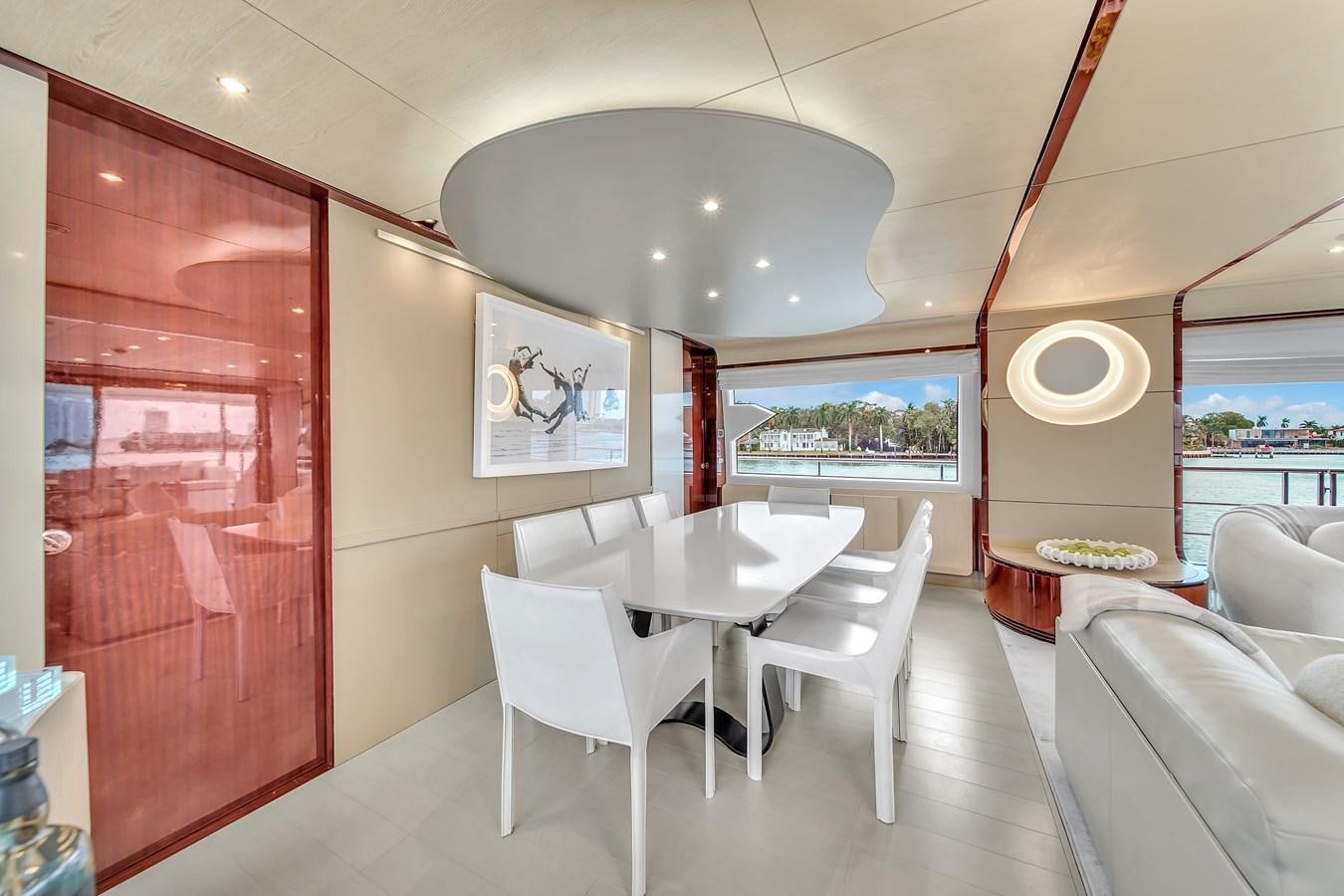 a room with tables and chairs aboard 95 RAISED PILOTHOUSE Yacht for Sale