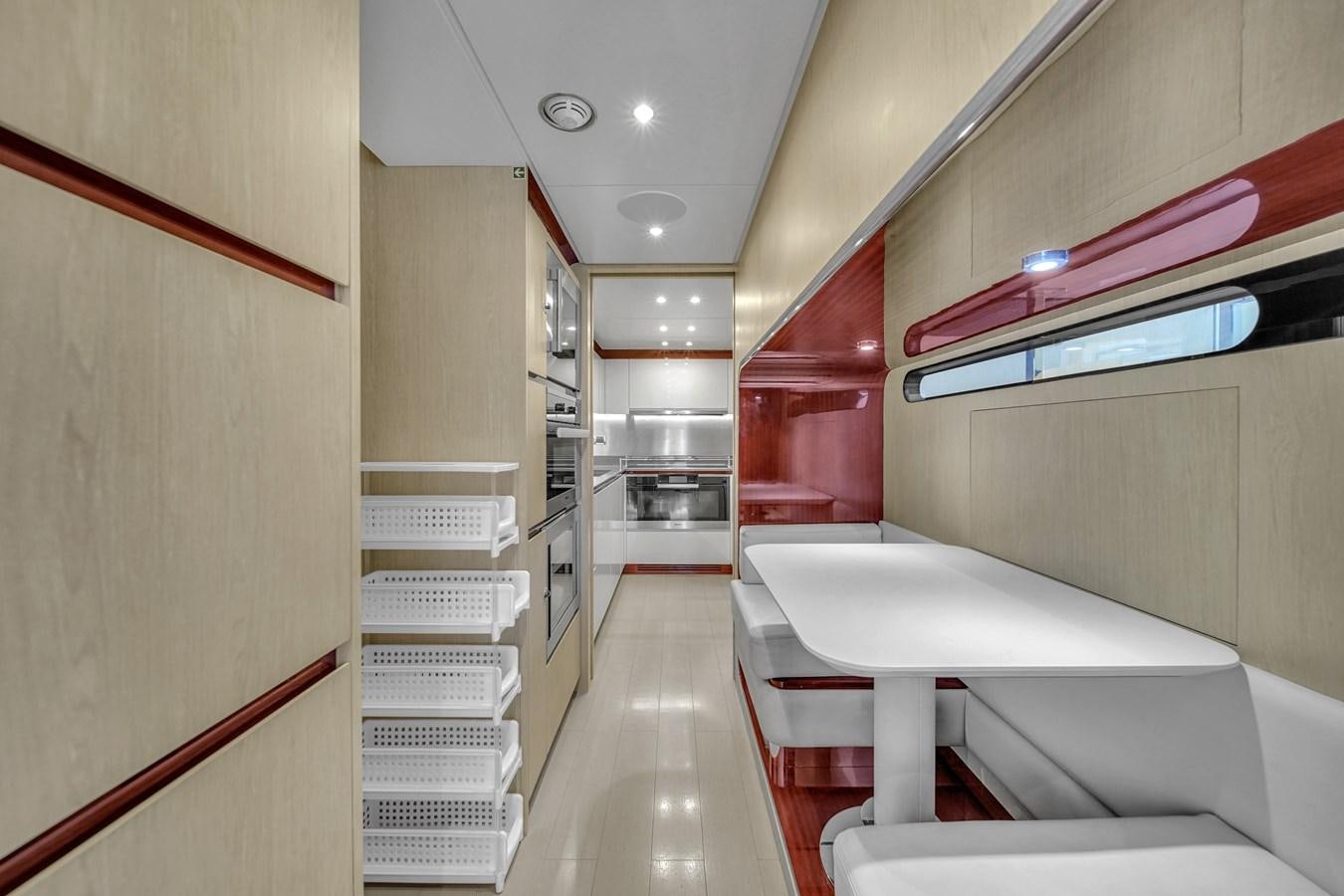 a room with a white table and a red and purple lighting aboard 95 RAISED PILOTHOUSE Yacht for Sale