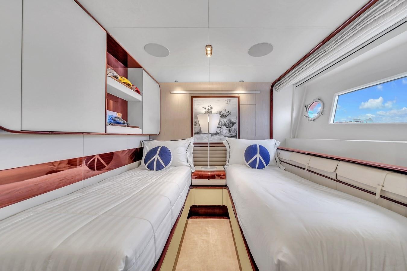 a room with a bed and a tv aboard 95 RAISED PILOTHOUSE Yacht for Sale