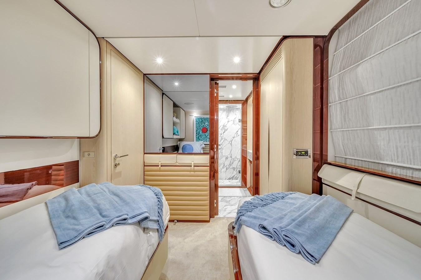 a room with a bed and a closet aboard 95 RAISED PILOTHOUSE Yacht for Sale