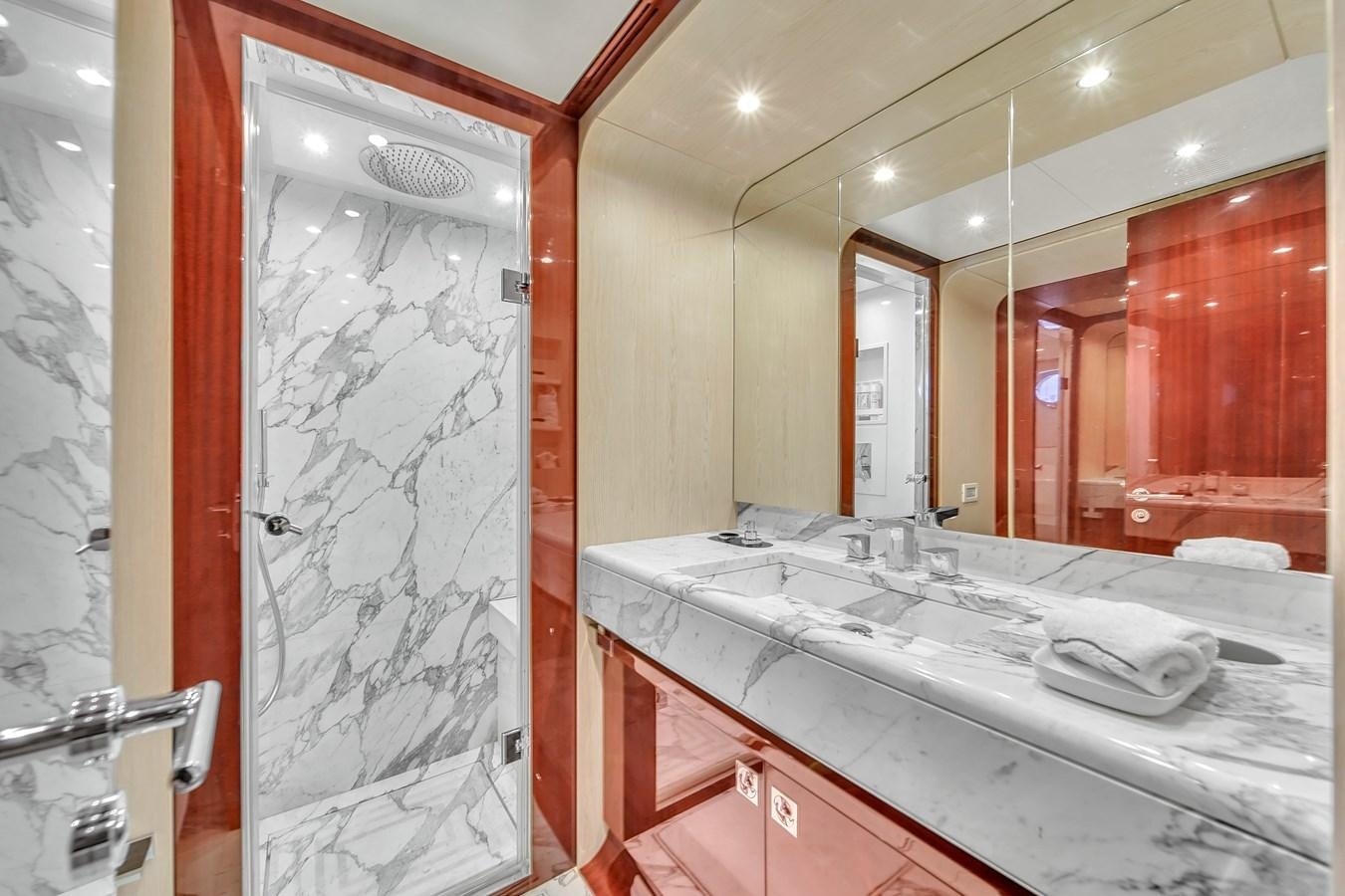 a bathroom with a large mirror aboard 95 RAISED PILOTHOUSE Yacht for Sale