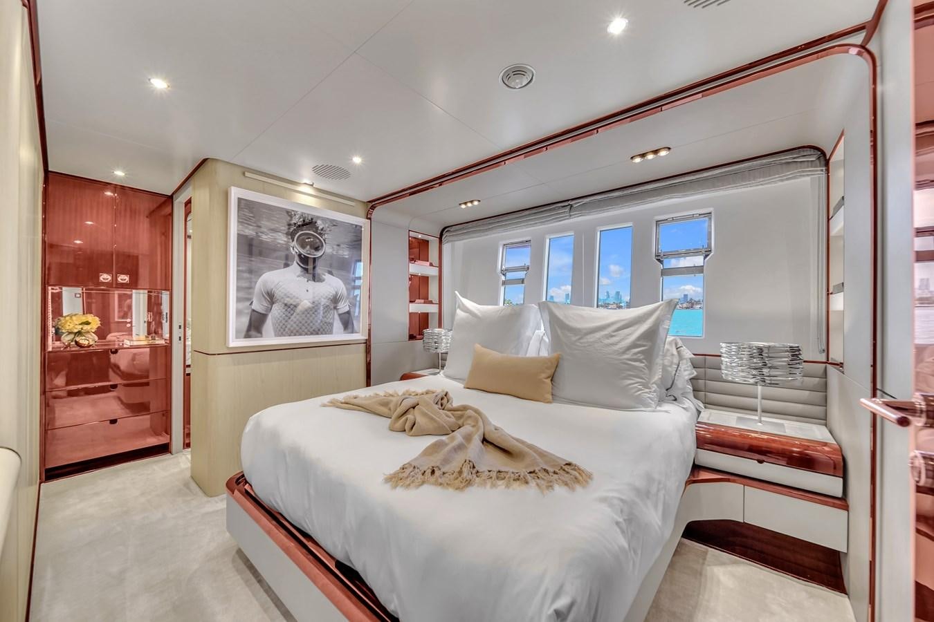 a bedroom with a large bed aboard 95 RAISED PILOTHOUSE Yacht for Sale