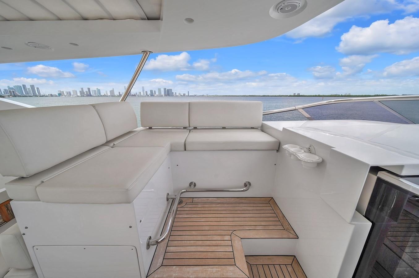 a white car on a road aboard 95 RAISED PILOTHOUSE Yacht for Sale