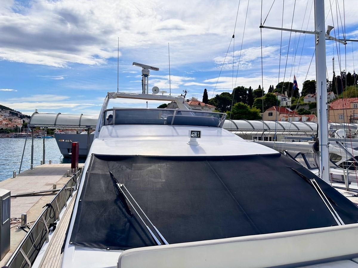 a boat docked at a pier aboard TAMARA II Yacht for Sale
