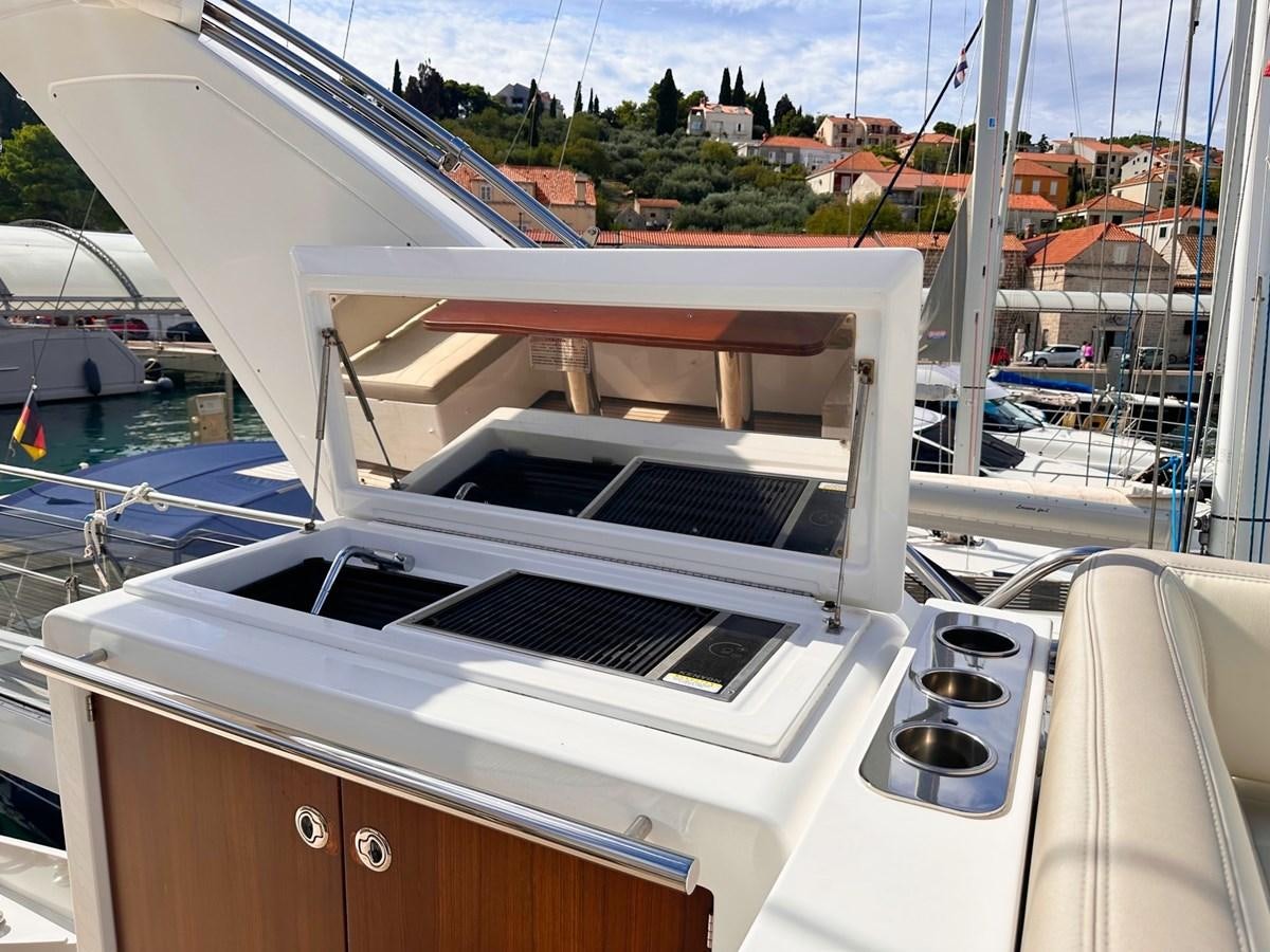 a deck with a white boat and a white deck and a view of a city aboard TAMARA II Yacht for Sale