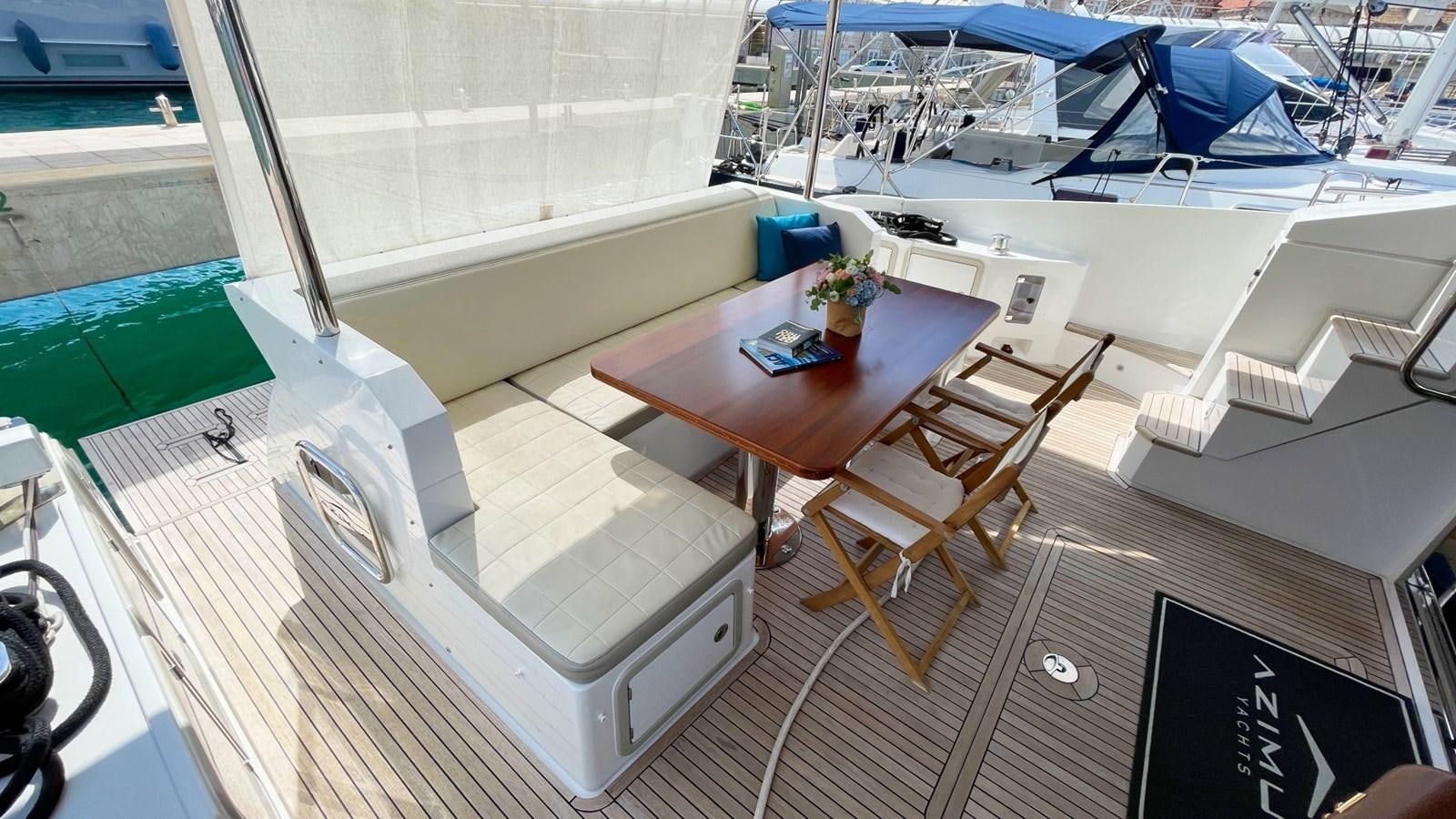 a room with a table and chairs aboard TAMARA II Yacht for Sale