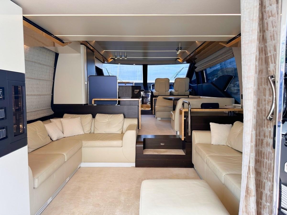 a room with a couch and a table and chairs aboard TAMARA II Yacht for Sale