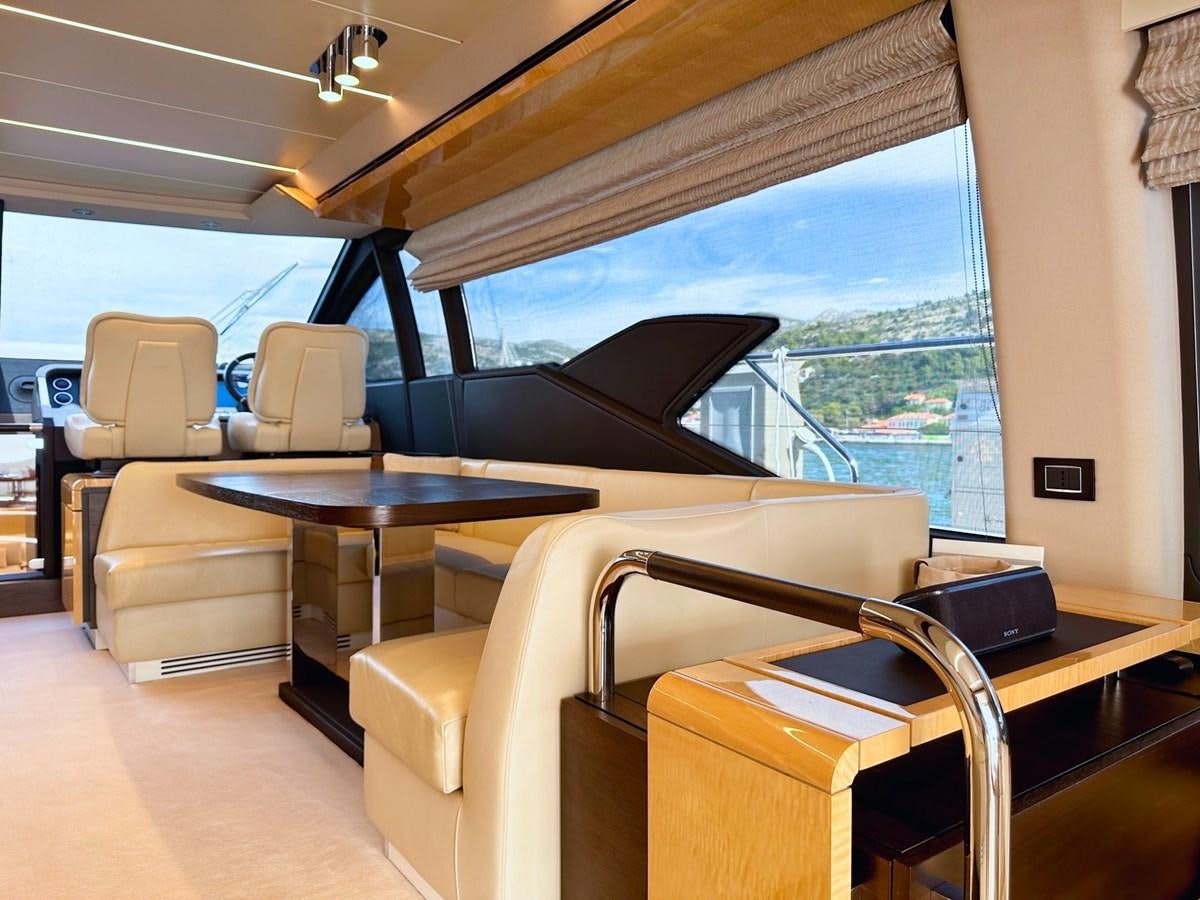 a room with a table and chairs aboard TAMARA II Yacht for Sale