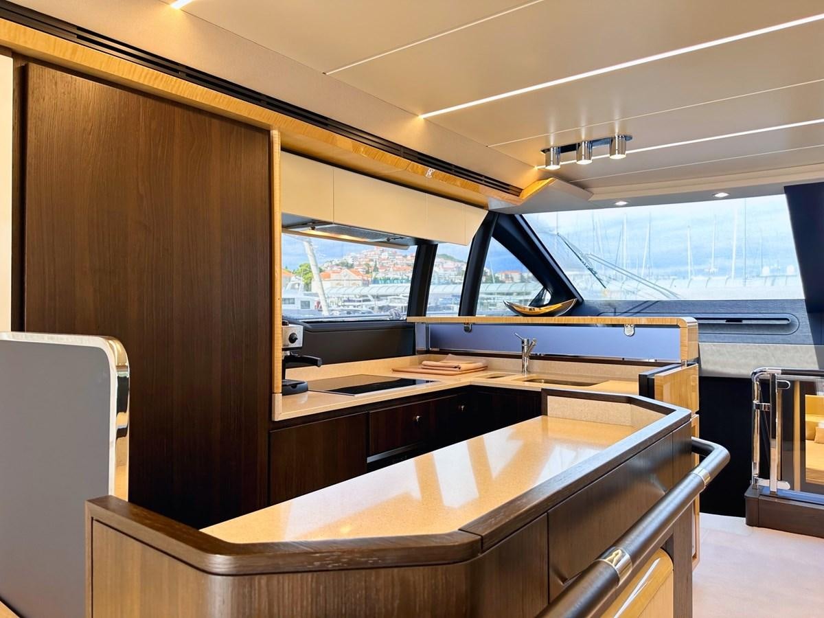 a room with a table and chairs aboard TAMARA II Yacht for Sale