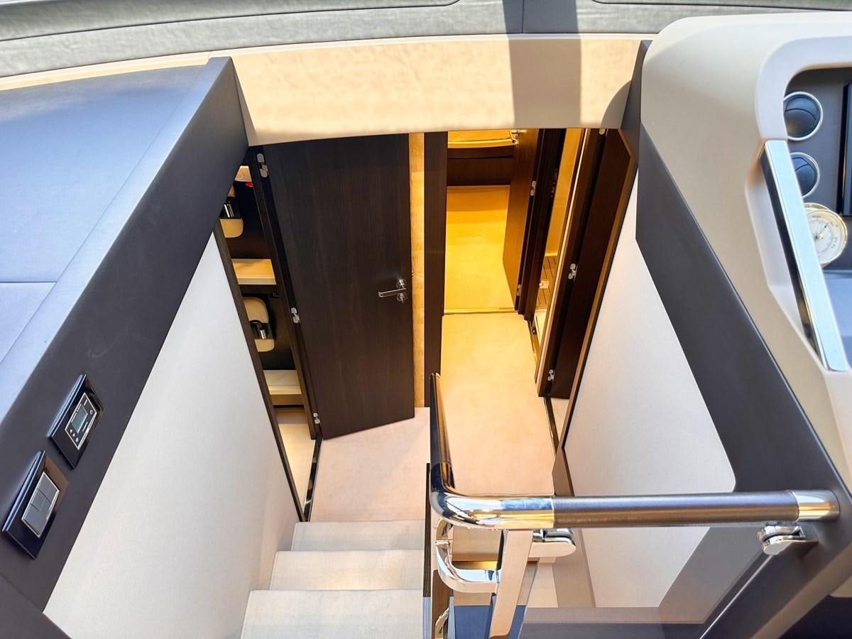 a hallway with a door and a mirror aboard TAMARA II Yacht for Sale