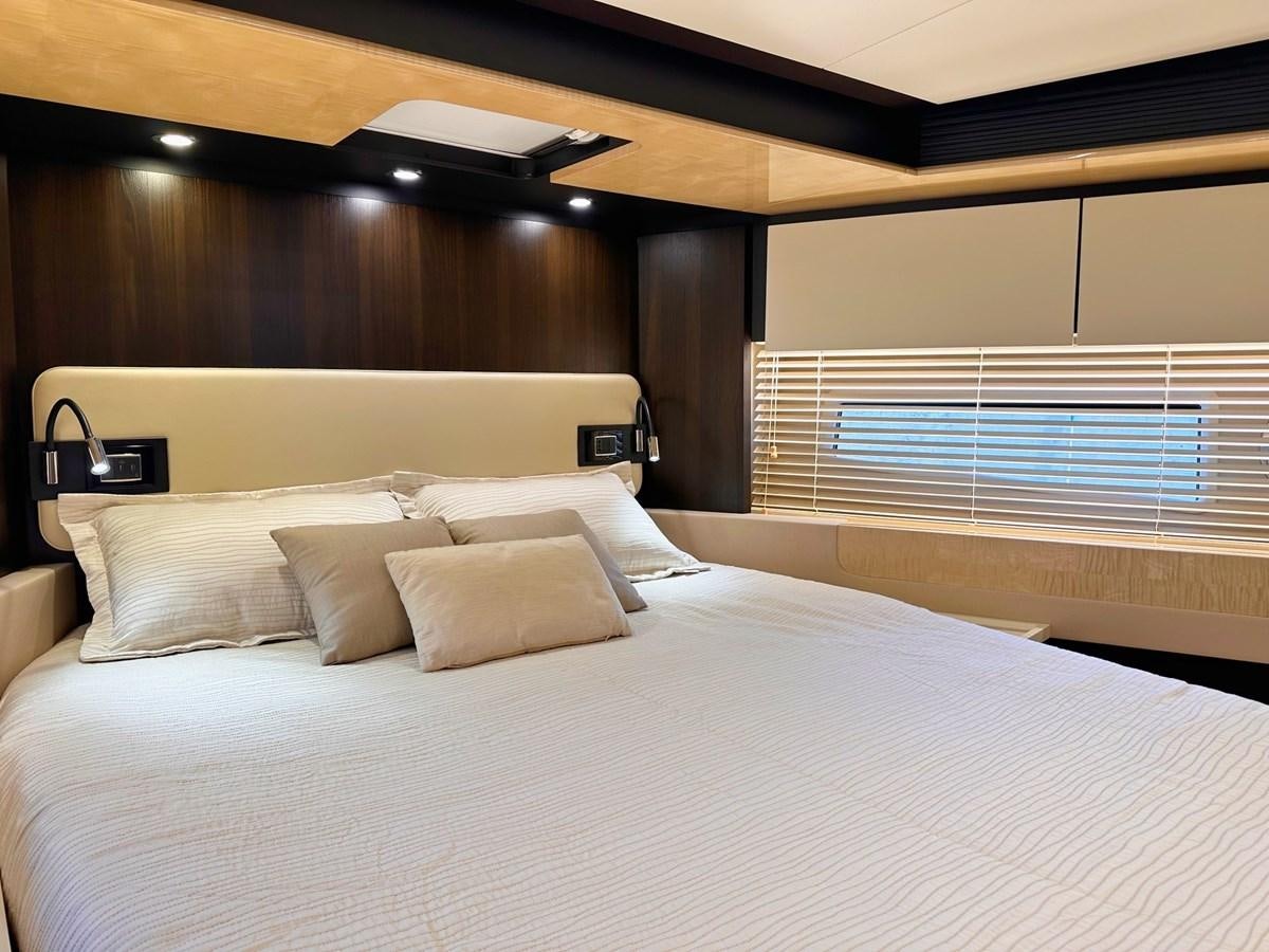 a bed with white sheets aboard TAMARA II Yacht for Sale