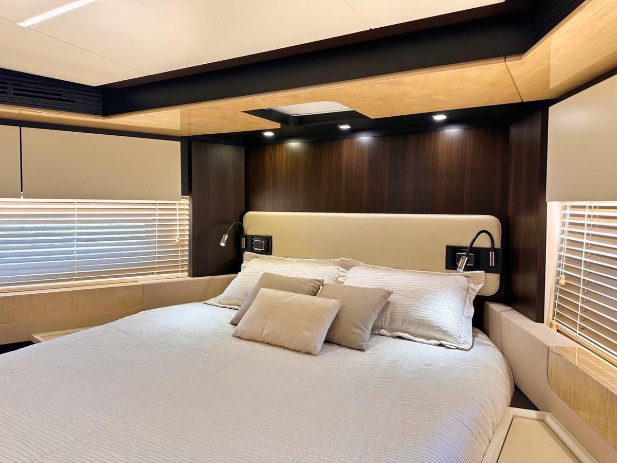 a bed with white sheets aboard TAMARA II Yacht for Sale