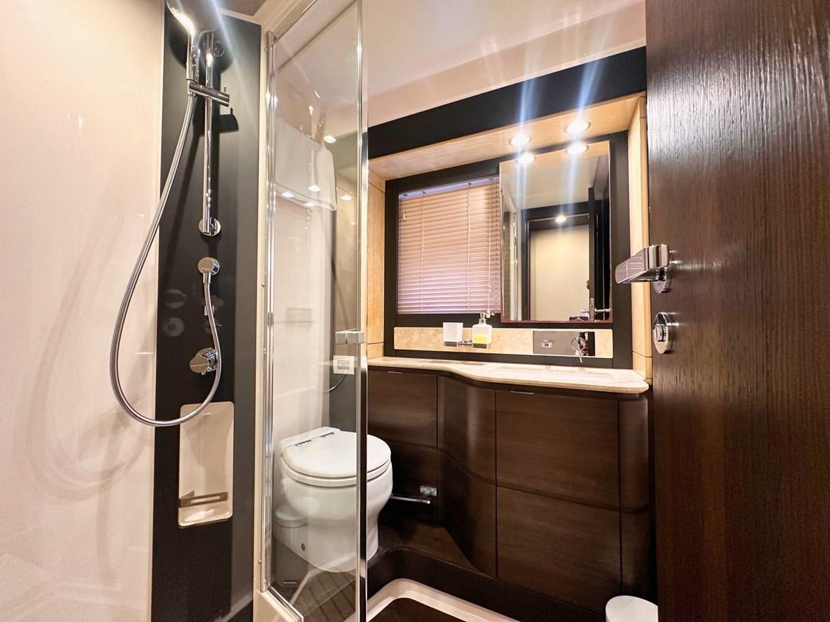 a bathroom with a toilet and a sink aboard TAMARA II Yacht for Sale