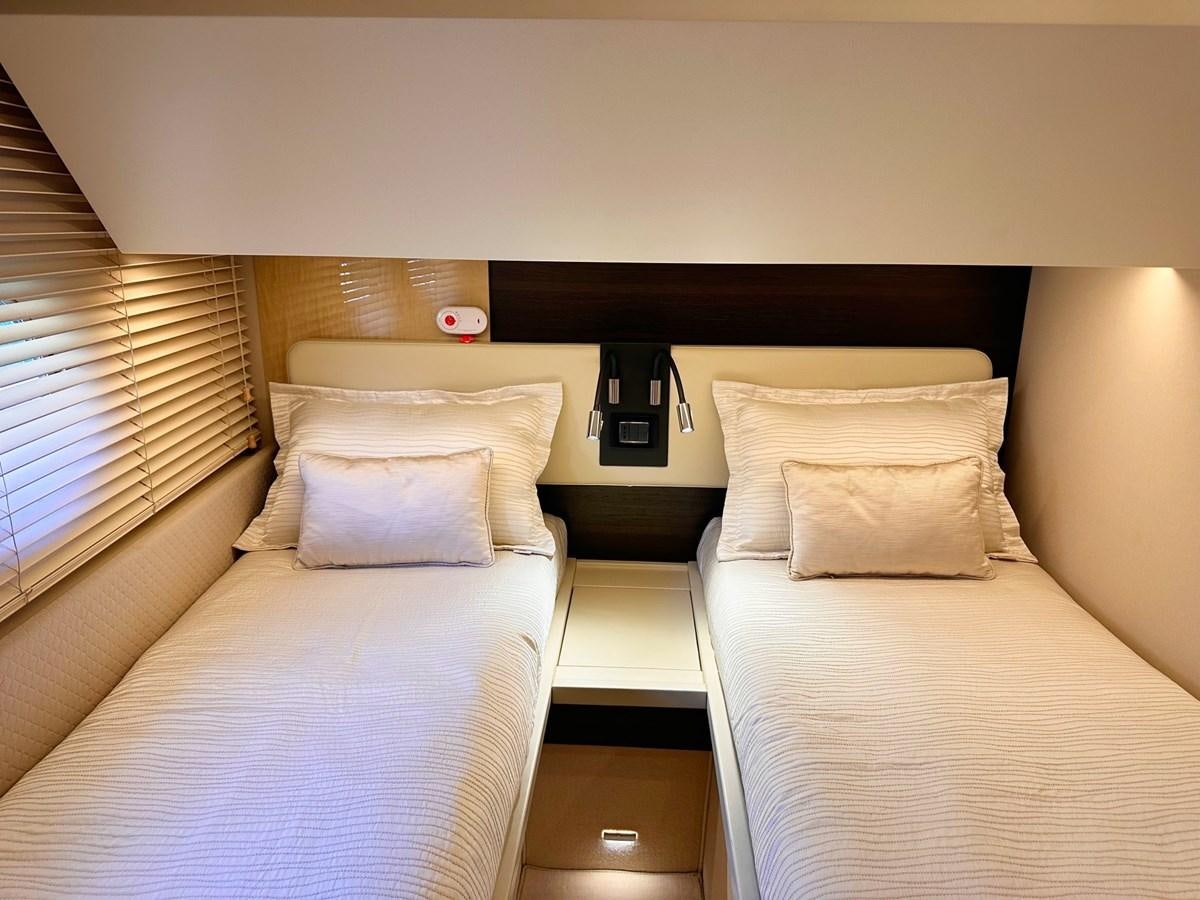 a couple of beds in a hotel room aboard TAMARA II Yacht for Sale