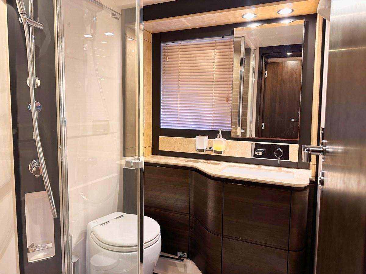 a bathroom with a toilet and a sink aboard TAMARA II Yacht for Sale