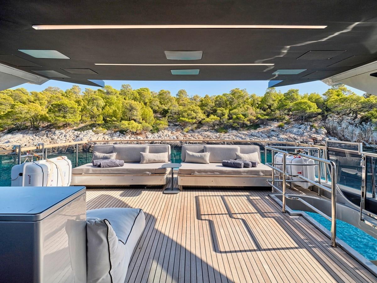 a deck with a large pool aboard SEAMMETRY Yacht for Sale