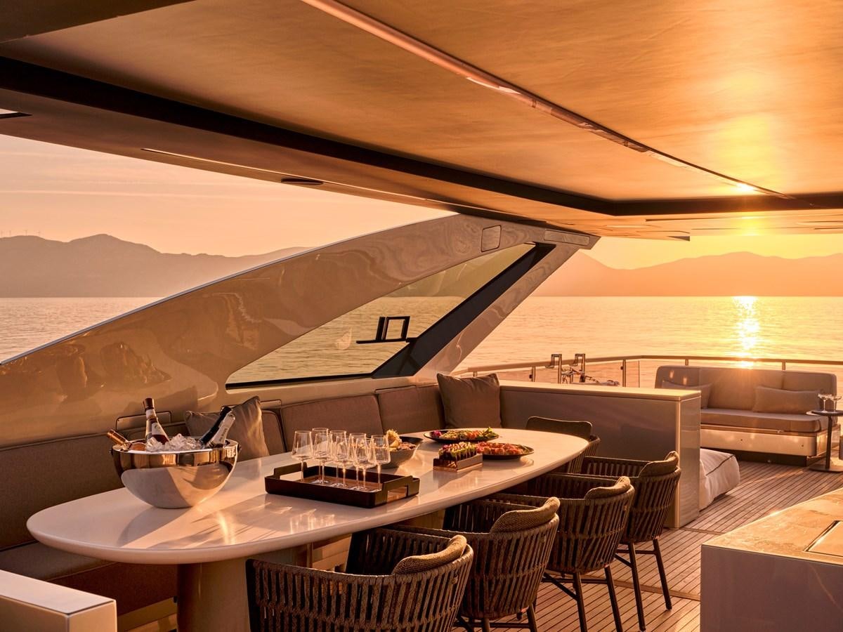 a room with a table and chairs aboard SEAMMETRY Yacht for Sale